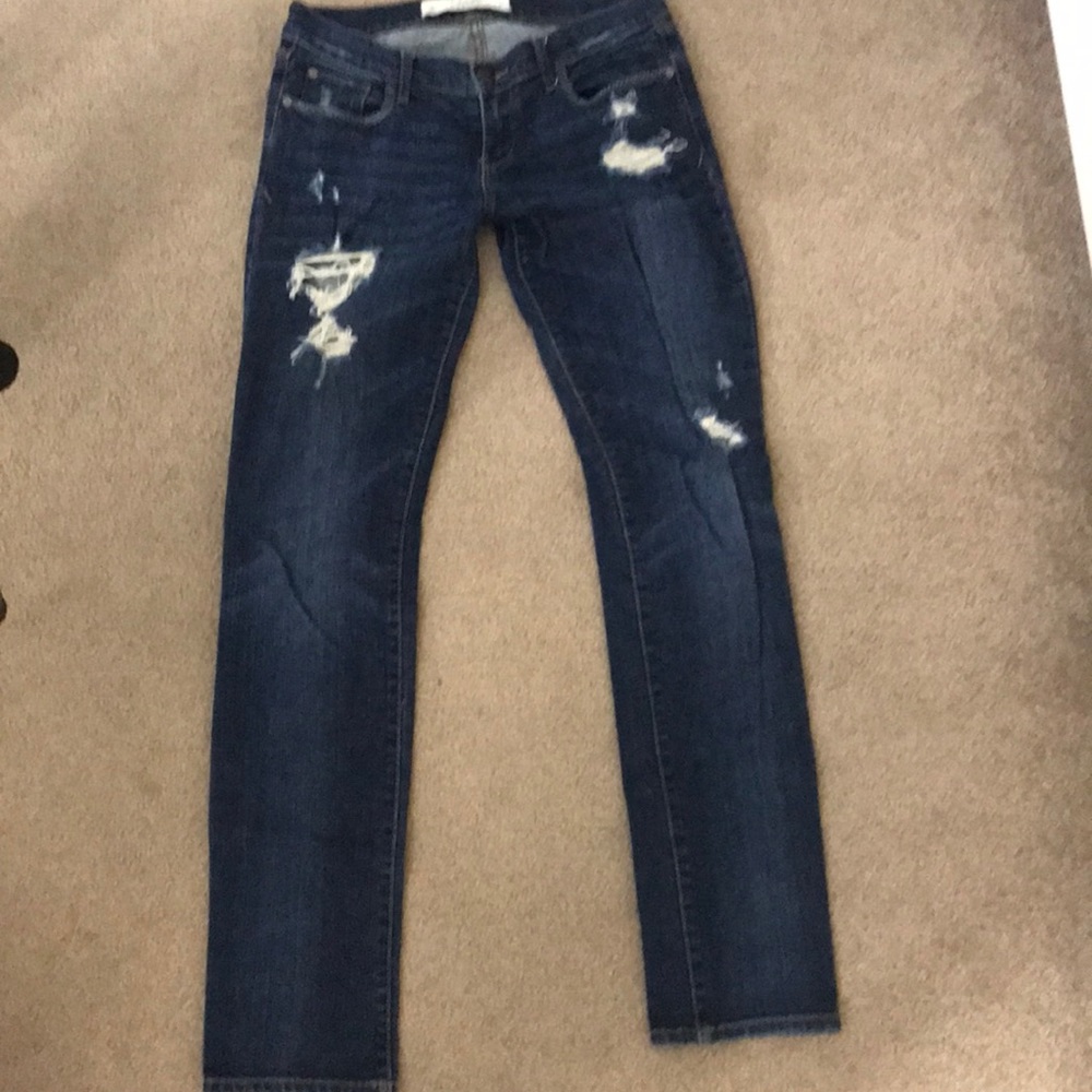 Dark washed ripped jeans.